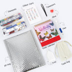 Collection of stationery items including a butterfly-themed desk calendar, bubble wrap, and other office supplies on a white background.