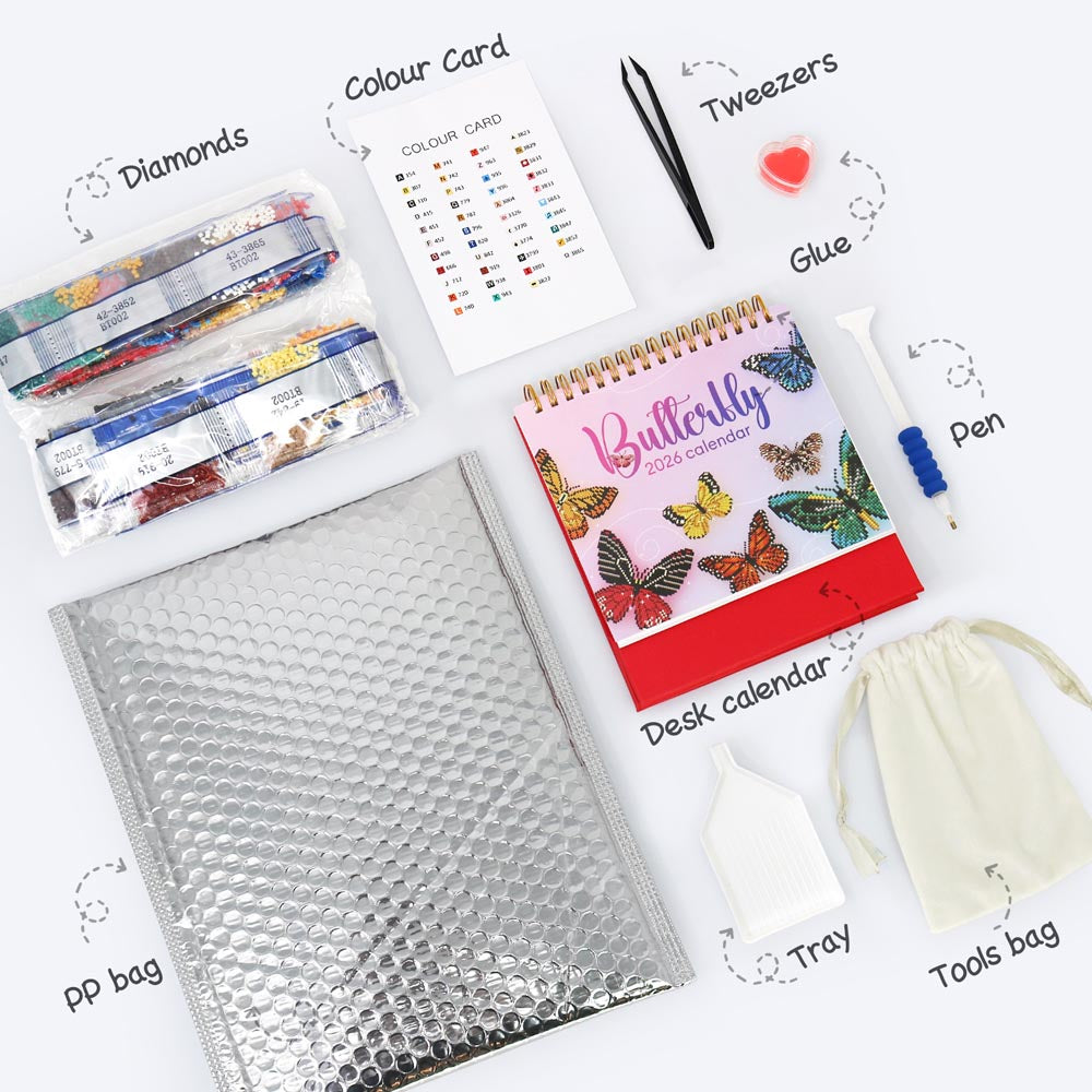 Collection of stationery items including a butterfly-themed desk calendar, bubble wrap, and other office supplies on a white background.